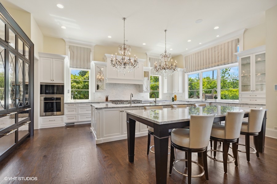 530 South Ridge Road Lake Forest, IL 60045 - Photo 10 of 46 a kitchen with stainless steel appliances a dining table chairs and wooden floor