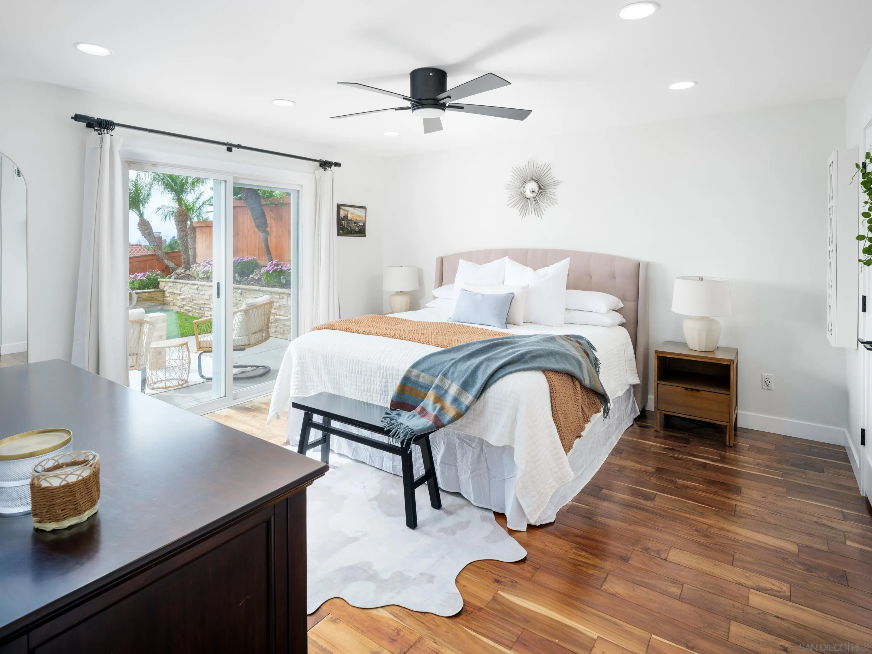 7053 Snapdragon Drive Carlsbad, CA 92011 - Photo 12 of 35 a bedroom with a bed and a desk