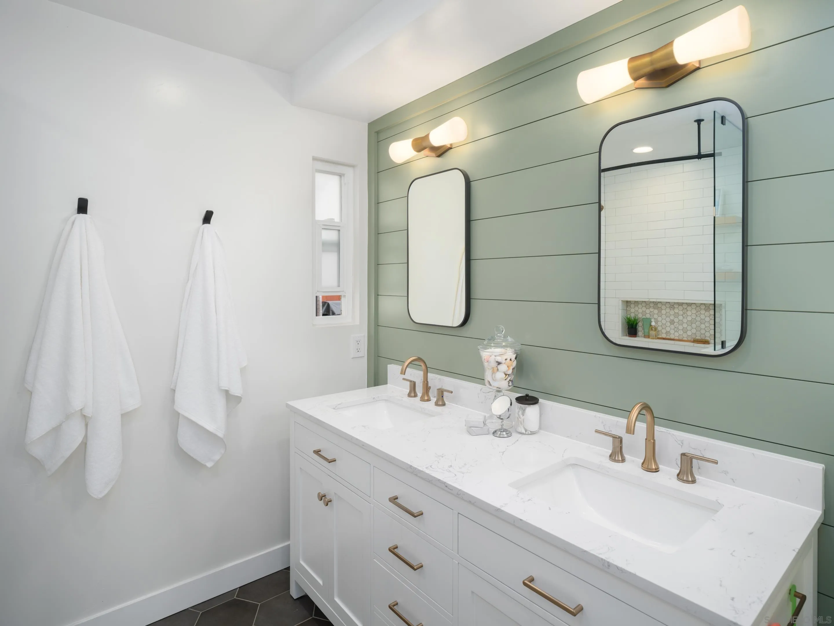 7053 Snapdragon Drive Carlsbad, CA 92011 - Photo 16 of 35 a bathroom with a double vanity sink mirror and