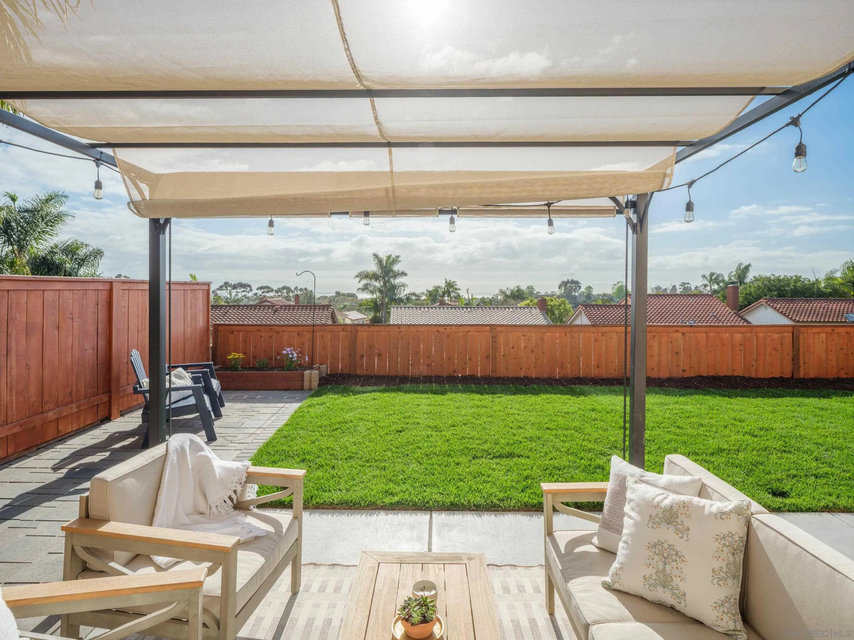 7053 Snapdragon Drive Carlsbad, CA 92011 - Photo 26 of 35 a view of a chair and table in the patio