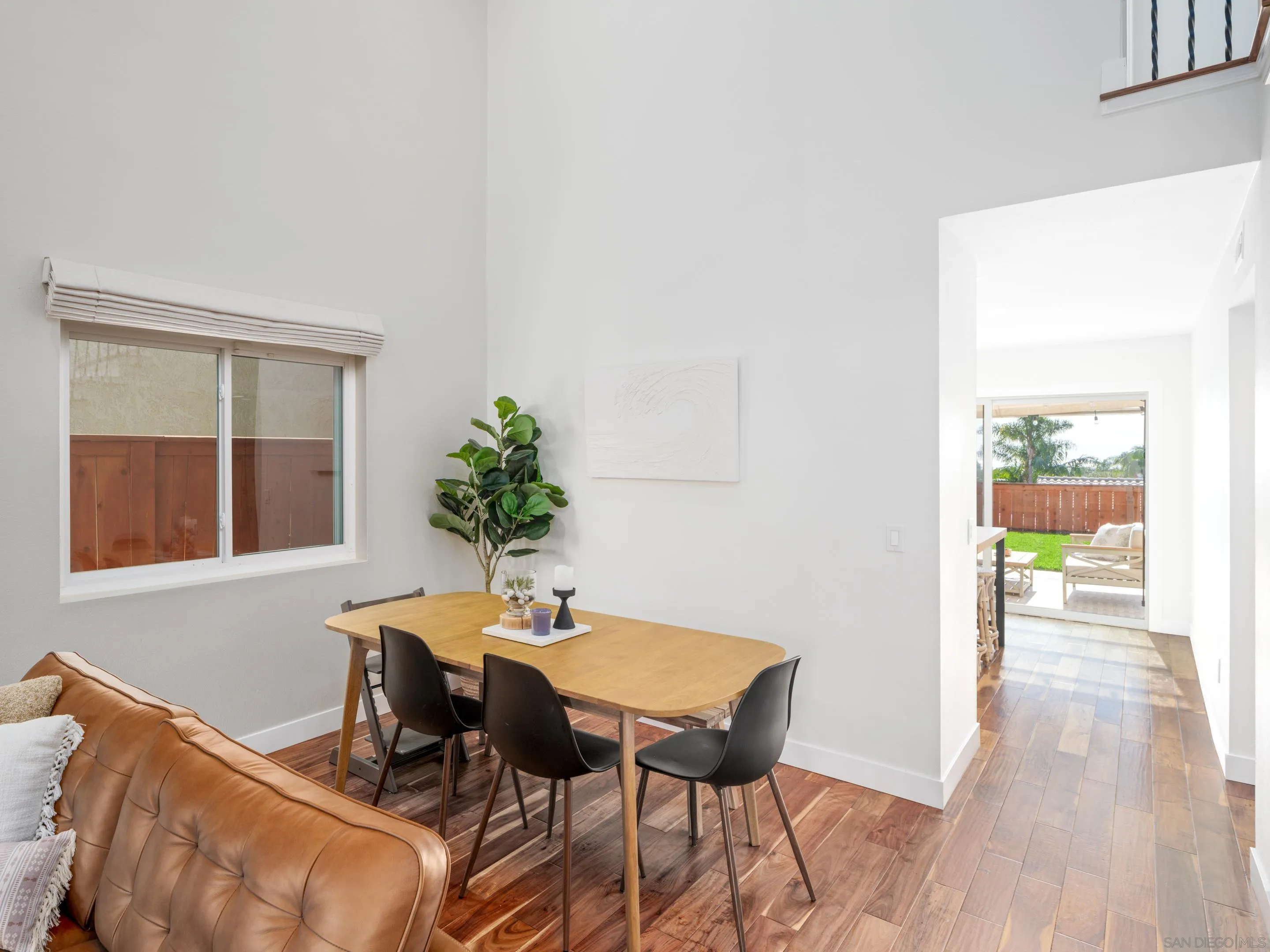 7053 Snapdragon Drive Carlsbad, CA 92011 - Photo 6 of 35 a view of a dining room with furniture and wooden floor