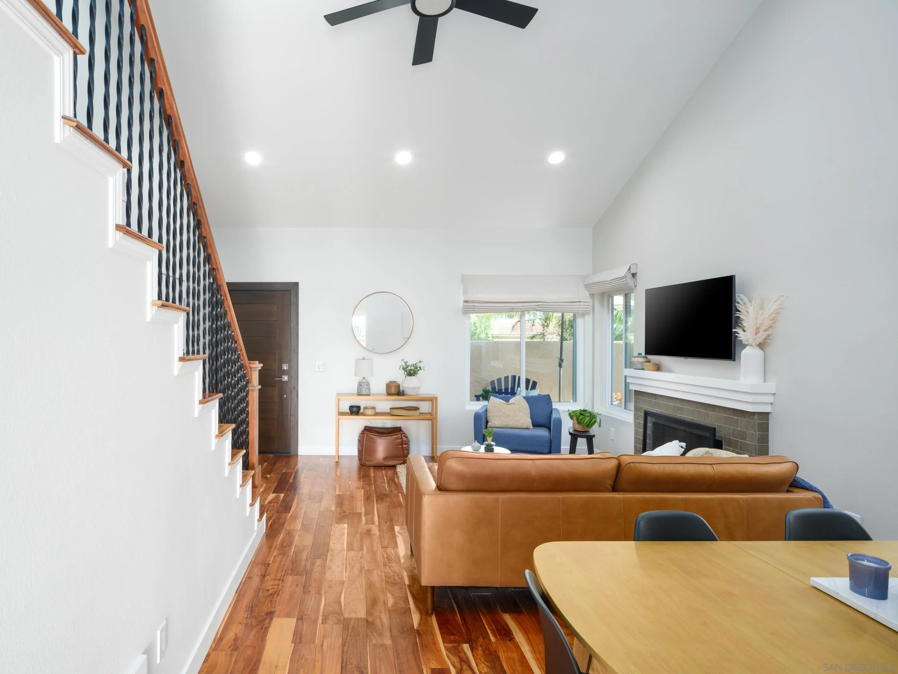 7053 Snapdragon Drive Carlsbad, CA 92011 - Photo 7 of 35 a living room with furniture and a flat screen tv