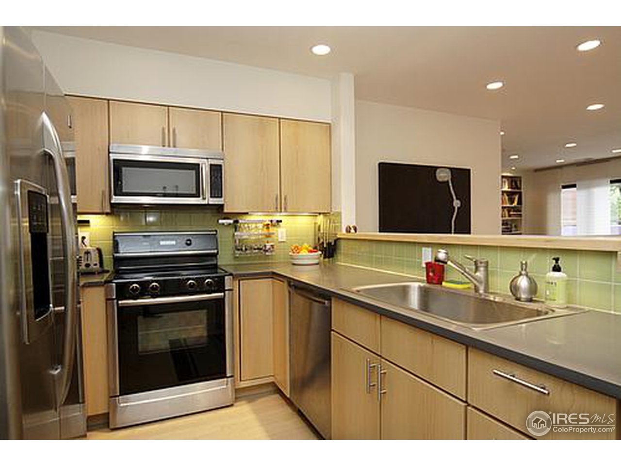 856 Walnut Street, Unit A Boulder, CO 80302 - Photo 2 of 13 a kitchen with a sink stove and microwave