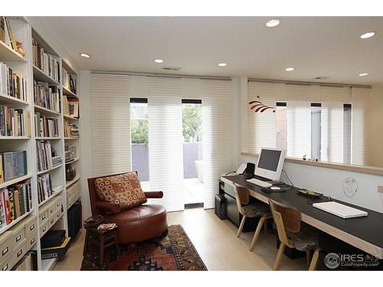 856 Walnut Street, Unit A Boulder, CO 80302 - Photo 5 of 13 a workspace with furniture and a bookshelf