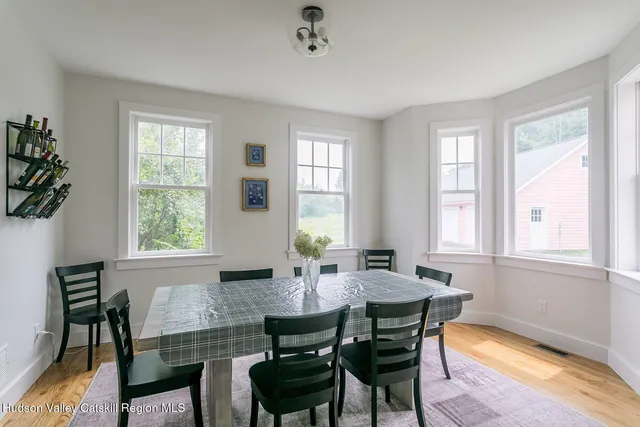 a dining room with furniture and window