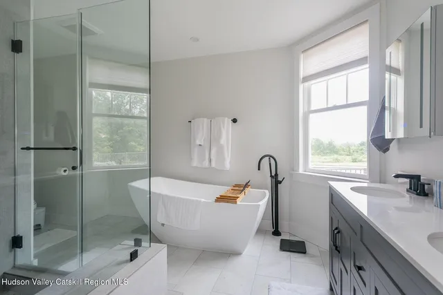 a bath room with a sink and a tub
