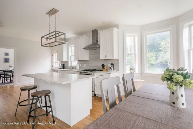 a very nice looking dining room with a table and chairs