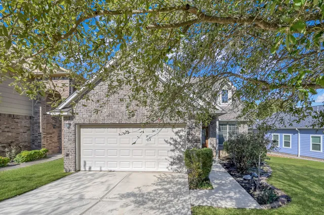 a view of a house with a tree
