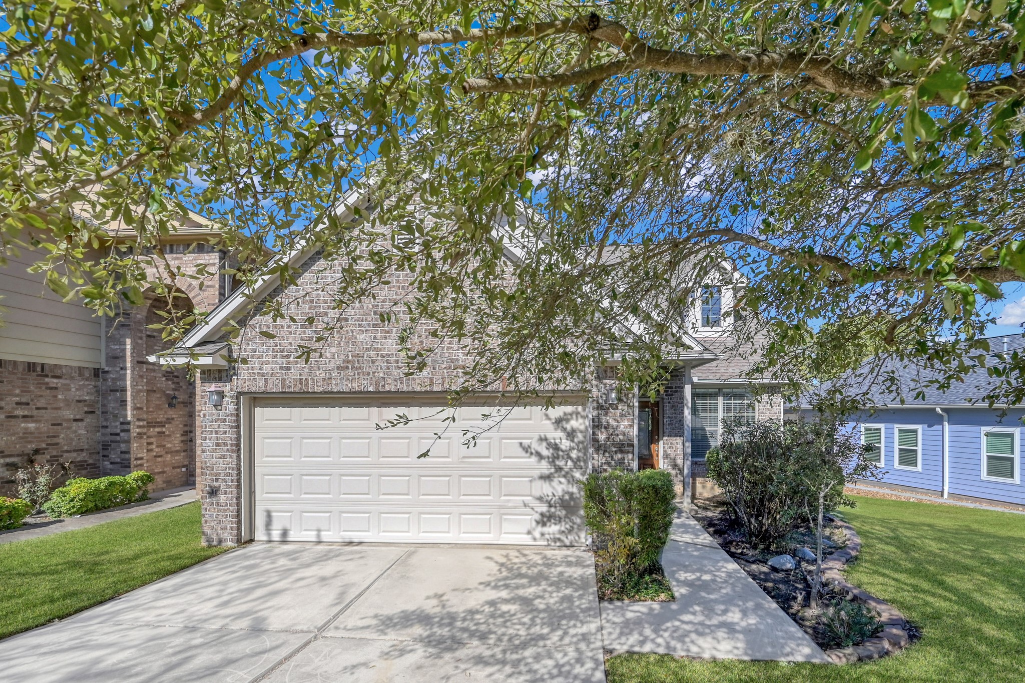 a view of a house with a tree