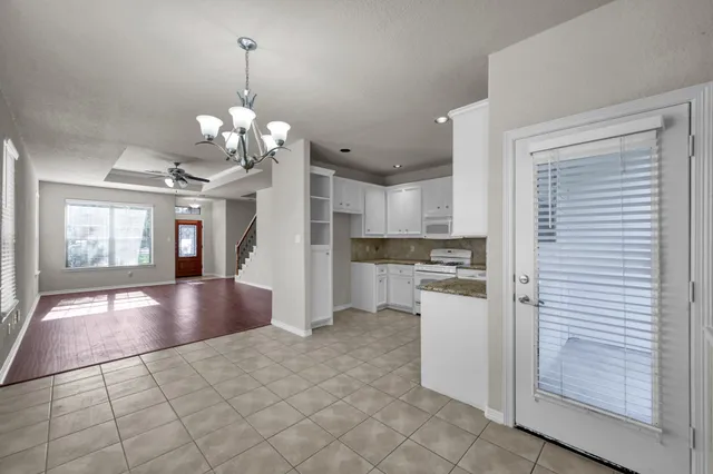 a view of a kitchen with a sink and cabinets