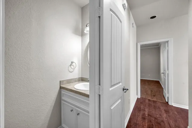 a bathroom with a sink and a mirror