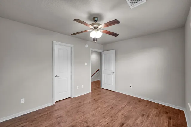 a view of a balcony with wooden floor