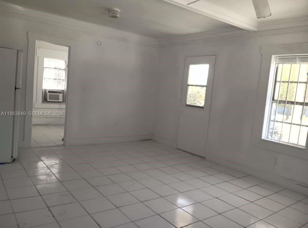 1925 Northwest 56th Street Miami, FL 33142 - Photo 14 of 27 an empty room with windows