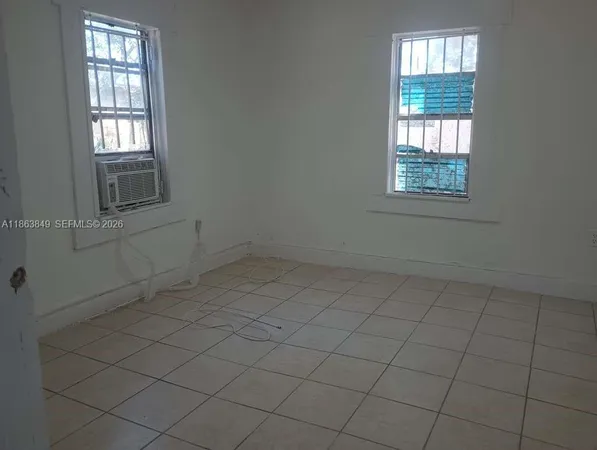 an empty room with windows