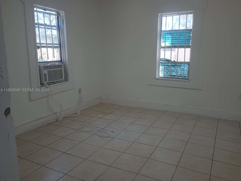 1925 Northwest 56th Street Miami, FL 33142 - Photo 16 of 27 an empty room with windows