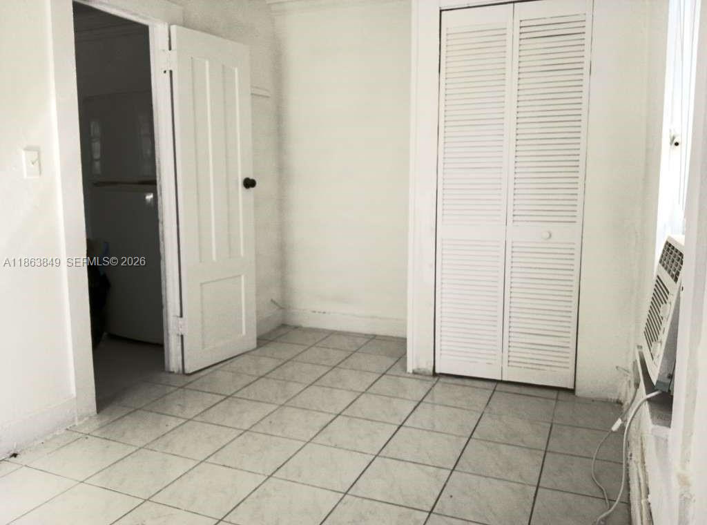 1925 Northwest 56th Street Miami, FL 33142 - Photo 17 of 27 an empty room with windows