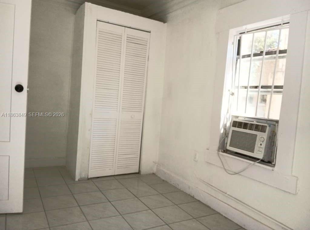 1925 Northwest 56th Street Miami, FL 33142 - Photo 18 of 27 a room with a bench and a shower