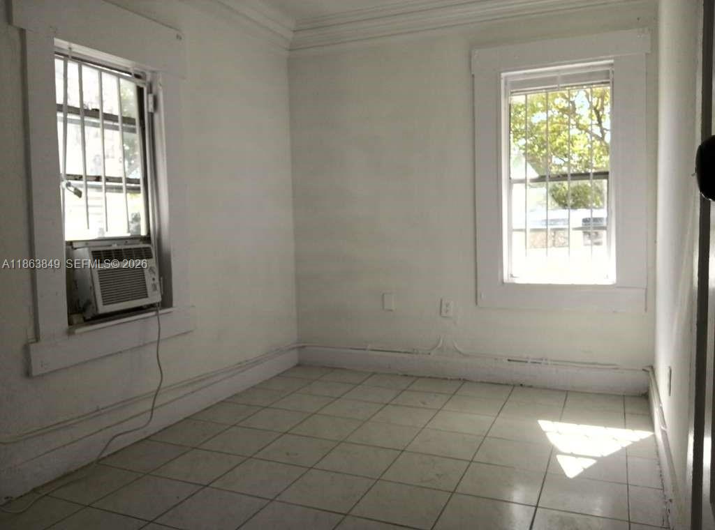 1925 Northwest 56th Street Miami, FL 33142 - Photo 20 of 27 an empty room with windows