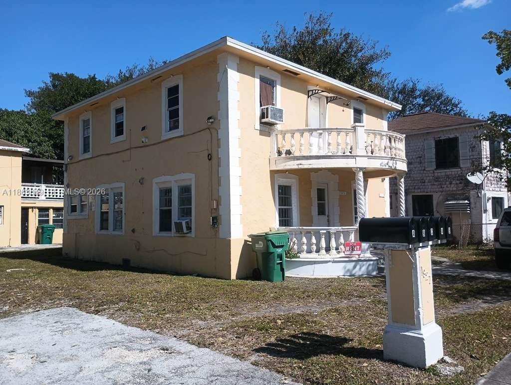 1925 Northwest 56th Street Miami, FL 33142 - Photo 21 of 27 a front view of a house with a porch