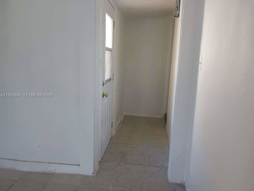 1925 Northwest 56th Street Miami, FL 33142 - Photo 27 of 27 an empty room with windows