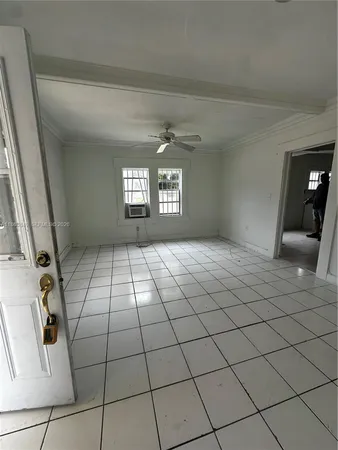 a view of an empty room and window