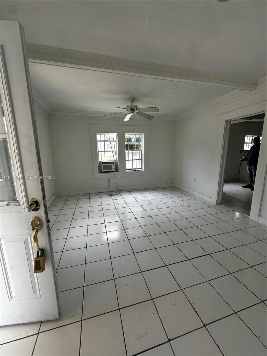 1925 Northwest 56th Street Miami, FL 33142 - Photo 4 of 27 a view of an empty room and window