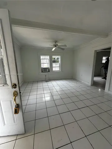 a view of an empty room and window