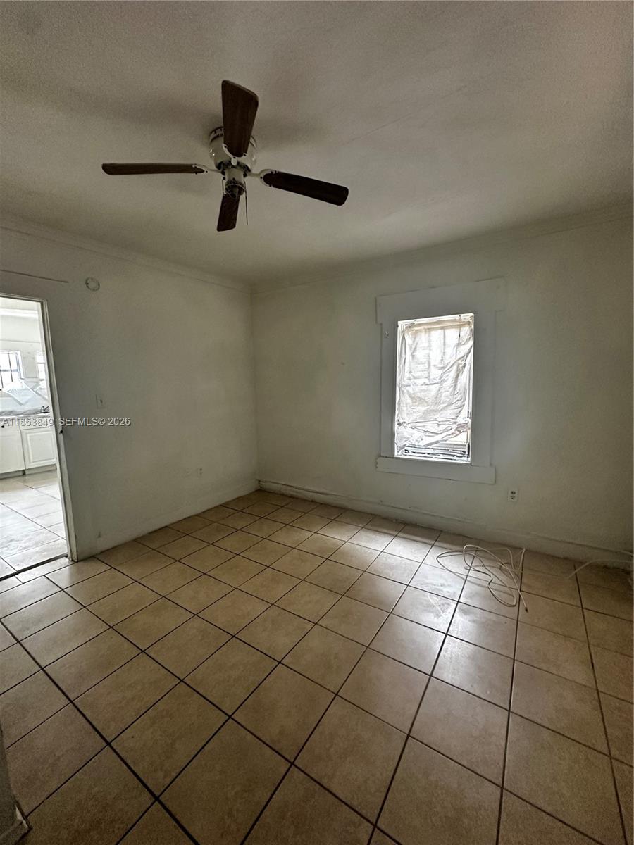 1925 Northwest 56th Street Miami, FL 33142 - Photo 7 of 27 a view of an empty room and a window