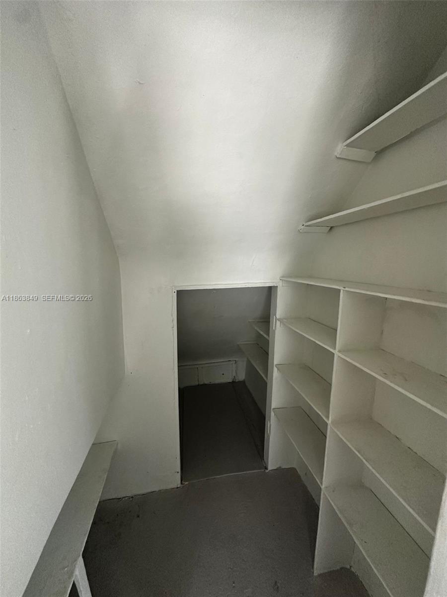 1925 Northwest 56th Street Miami, FL 33142 - Photo 9 of 27 a view of walk in closet with empty racks