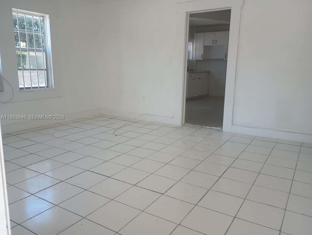 1925 Northwest 56th Street Miami, FL 33142 - Photo 10 of 27 an empty room with windows