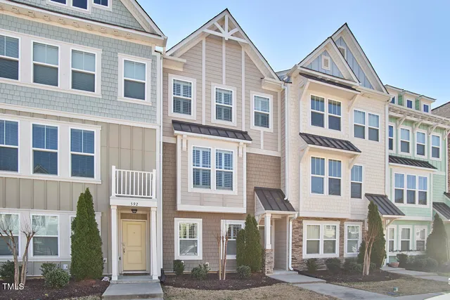 a front view of a building with glass windows