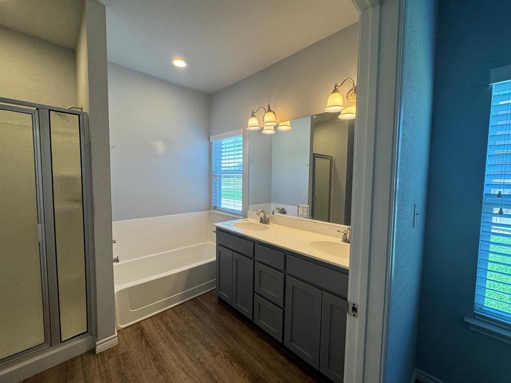 792 East Northside Drive Pilot Point, TX 76258 - Photo 11 of 18 a bathroom with a tub sink and mirror