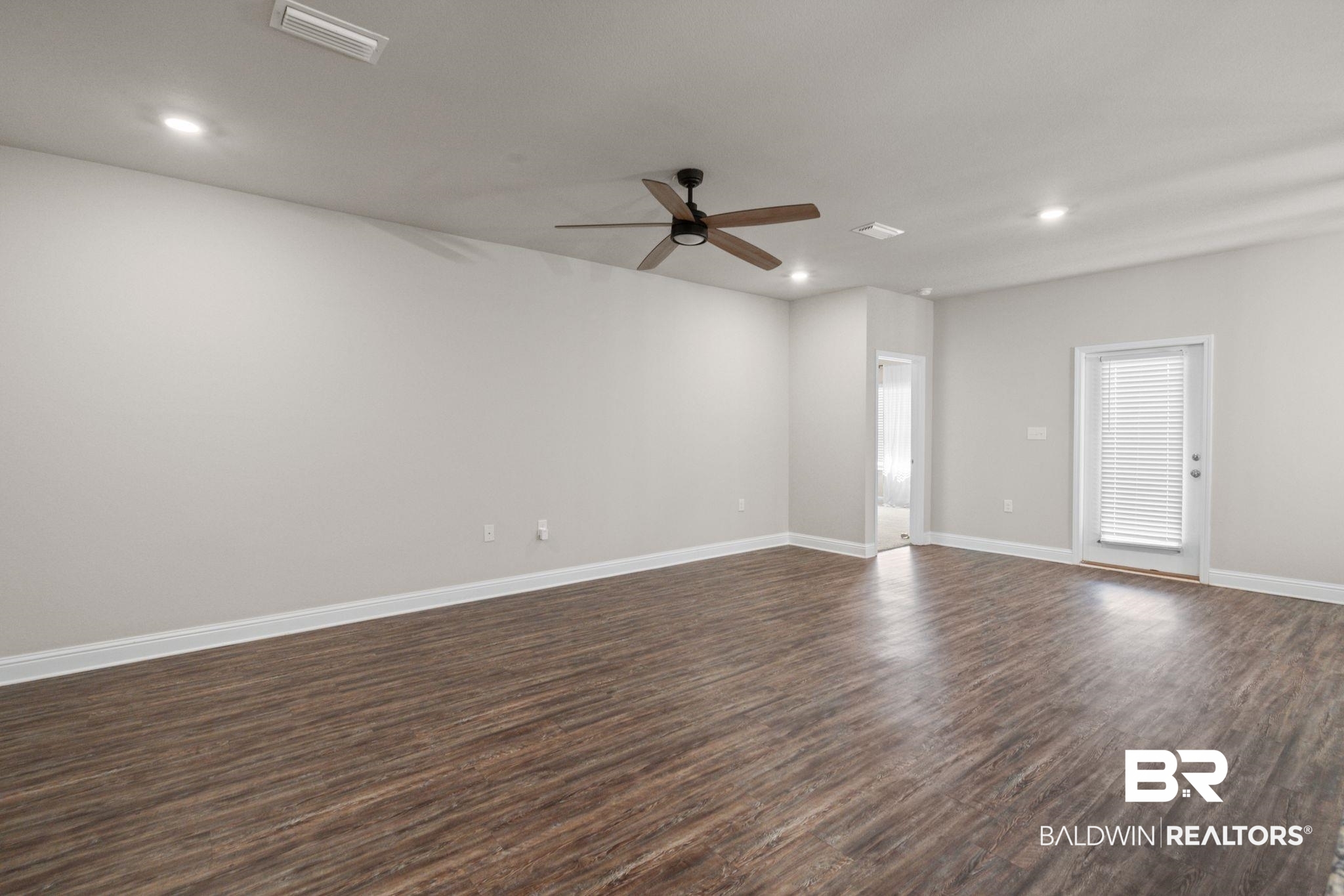 24769 Slater Mill Road Daphne, AL 36526 - Photo 14 of 38 Empty room featuring ceiling fan and dark hardwood / wood-style floors