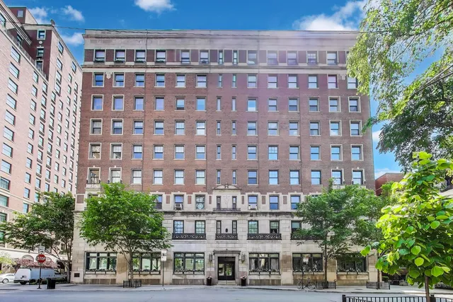 a view of a building with a yard