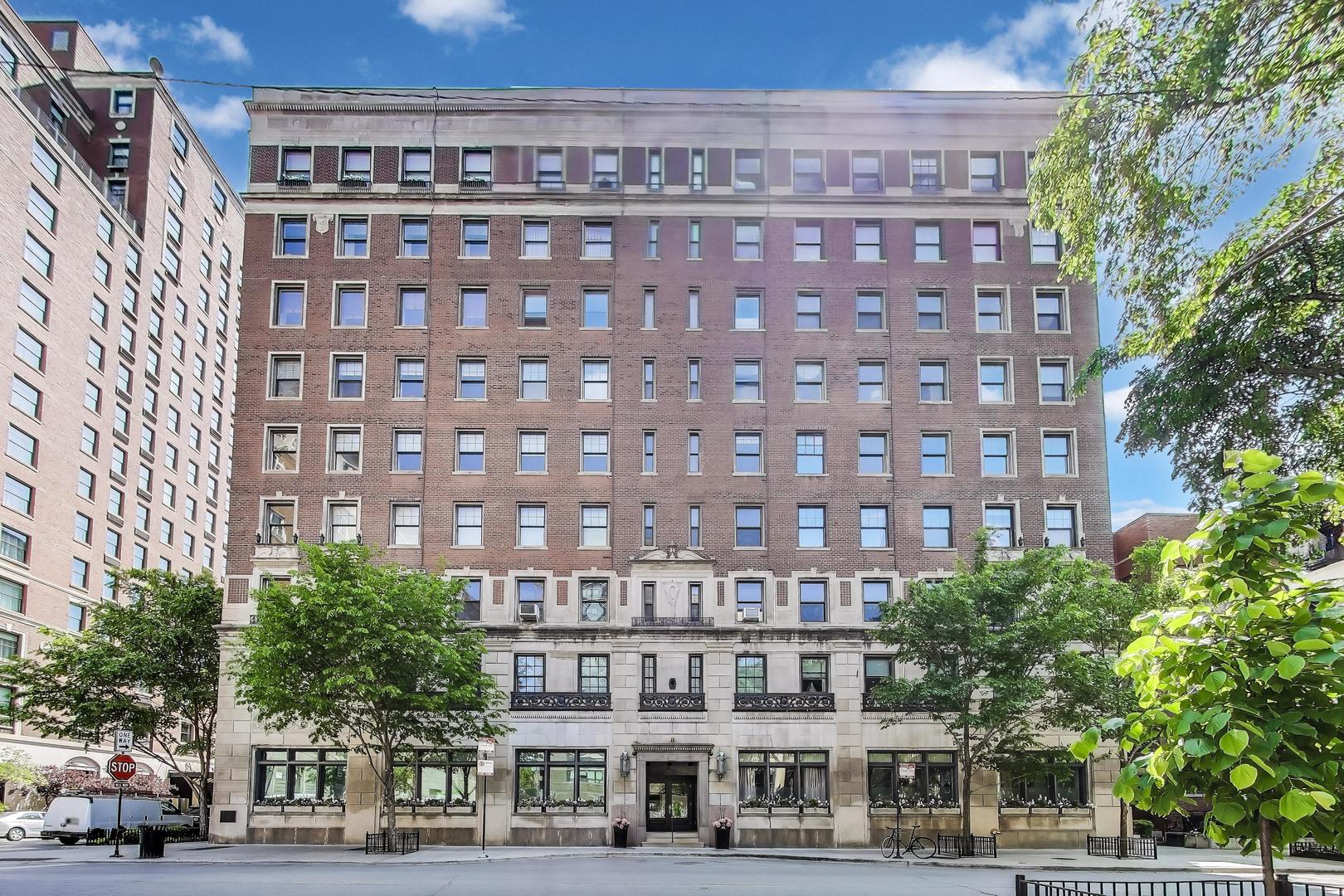 a view of a building with a yard