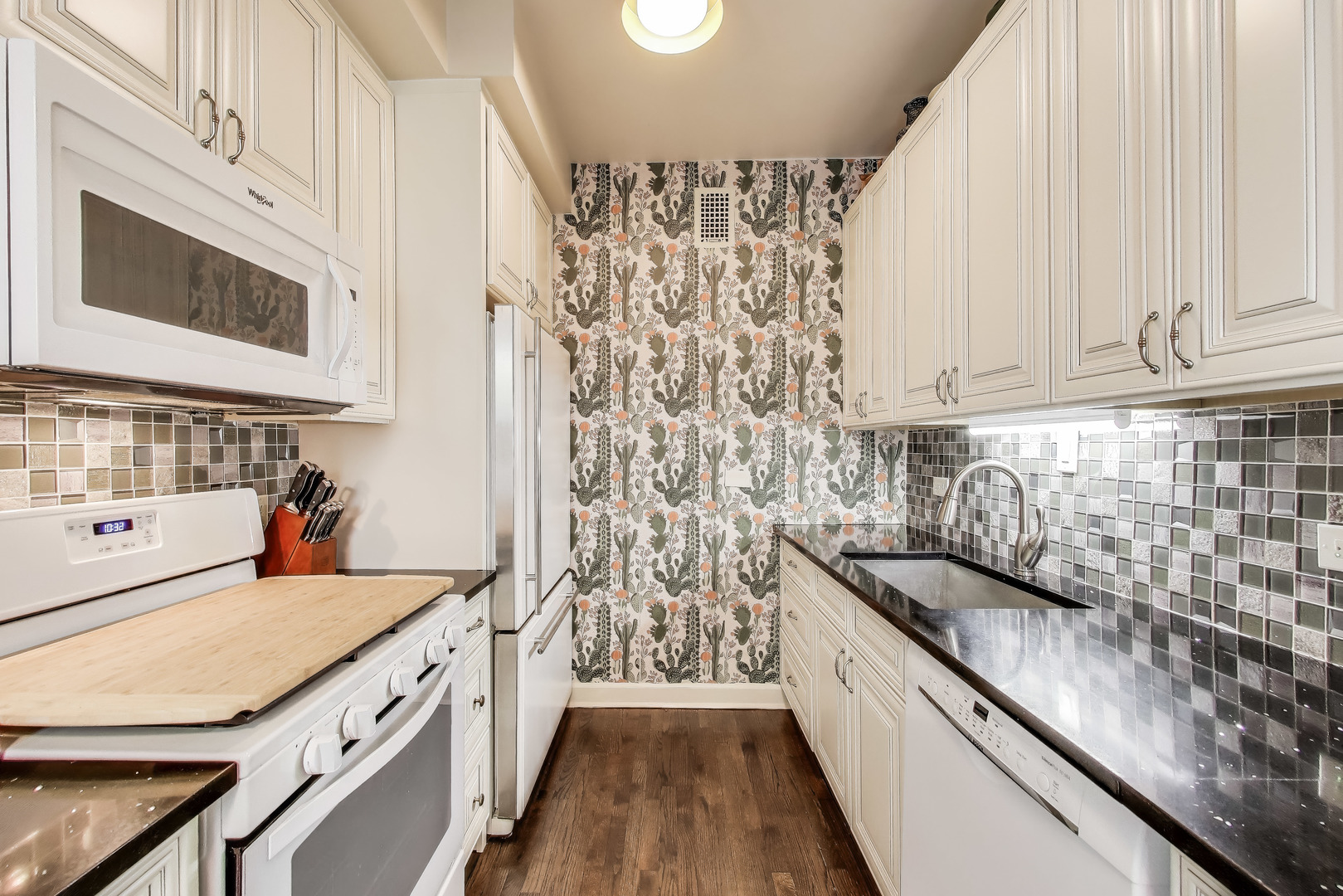 1255 North State Parkway, Unit 2E3E Chicago, IL 60610 - Photo 11 of 38 a kitchen with stainless steel appliances a stove and a refrigerator