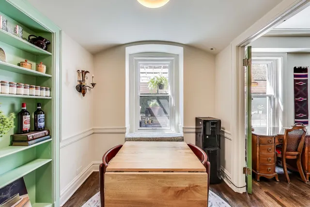 a bed room with a bed and a book shelf
