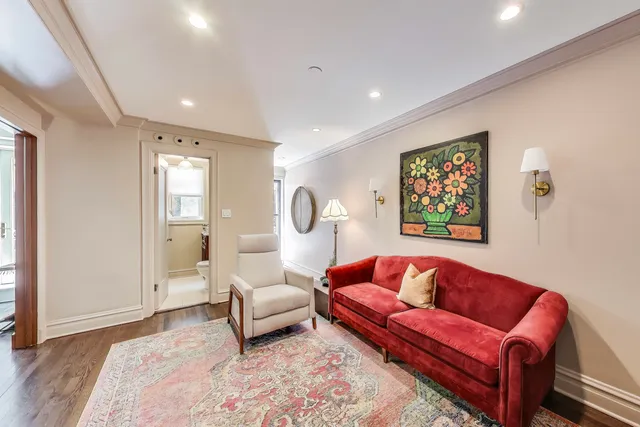 a living room with furniture and a rug