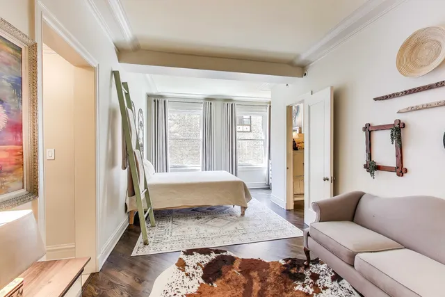 a living room with a couch and a window