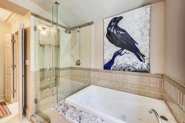 a bathroom with a tub and shower