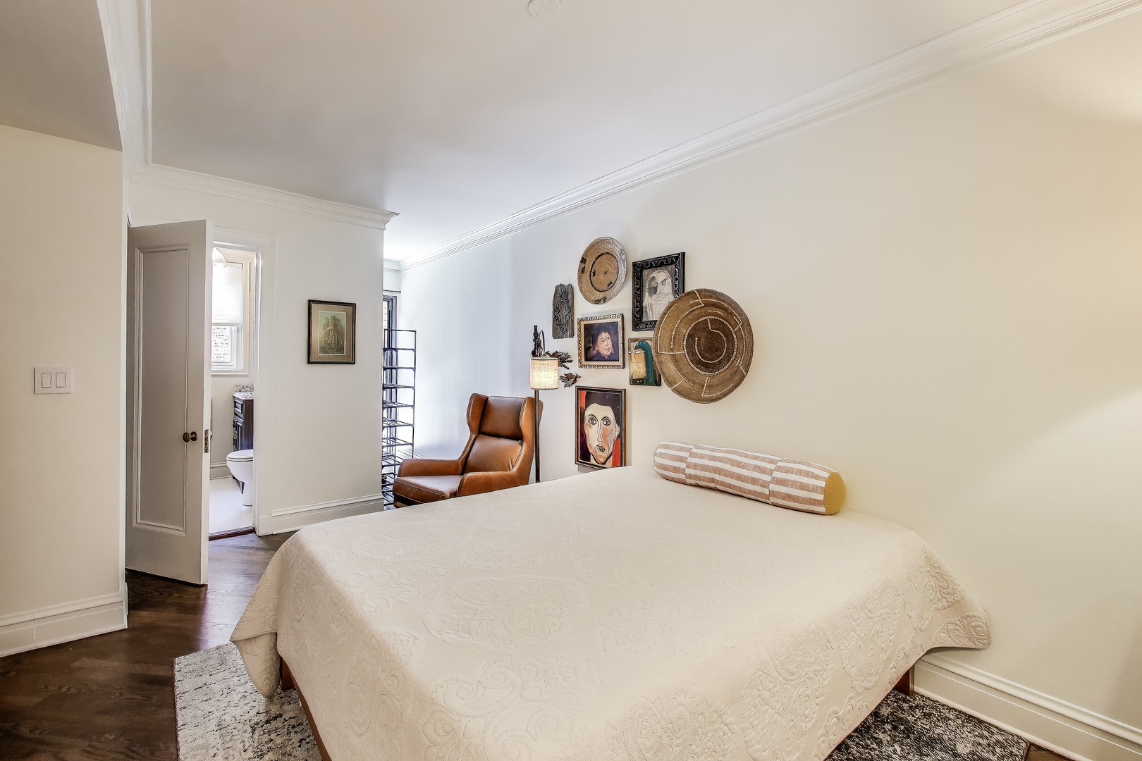 1255 North State Parkway, Unit 2E3E Chicago, IL 60610 - Photo 24 of 38 a bedroom with a bed and painting on the wall