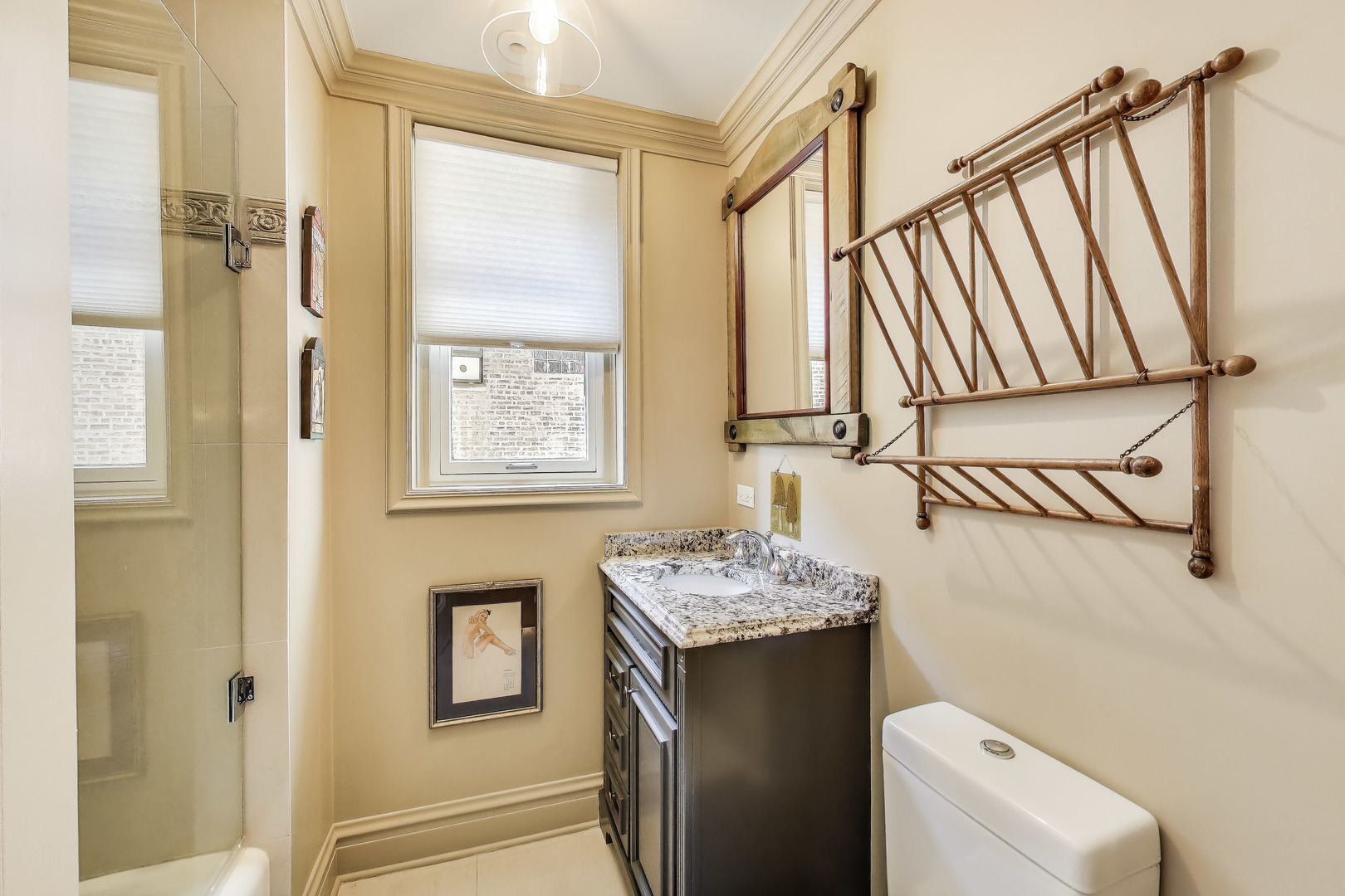 1255 North State Parkway, Unit 2E3E Chicago, IL 60610 - Photo 25 of 38 a bathroom with a sink and a mirror