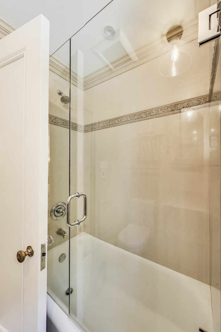1255 North State Parkway, Unit 2E3E Chicago, IL 60610 - Photo 26 of 38 a bathroom with a shower and a shower
