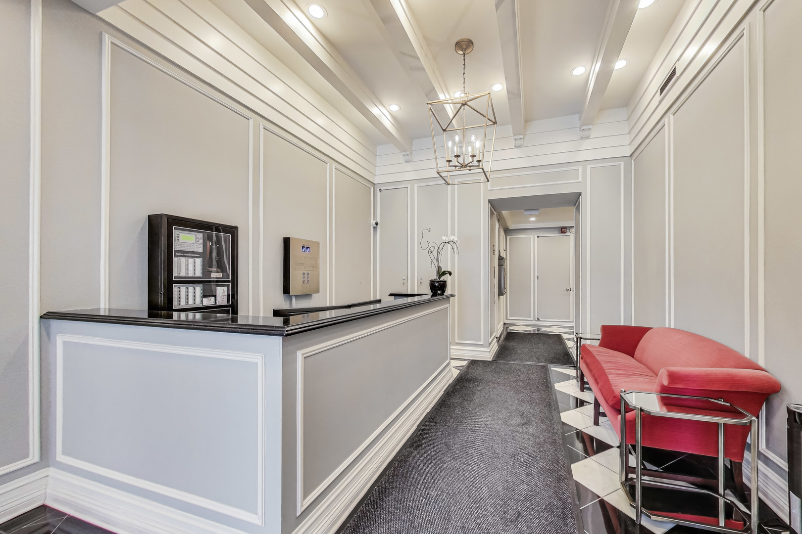 1255 North State Parkway, Unit 2E3E Chicago, IL 60610 - Photo 5 of 38 a large white kitchen with stainless steel appliances granite countertop a sink and a refrigerator