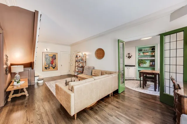 a bed room with a bed and a chair