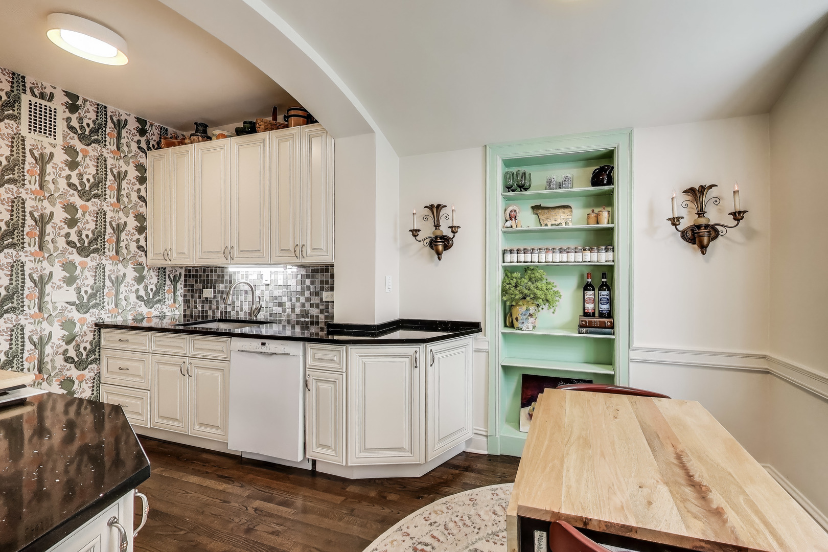 1255 North State Parkway, Unit 2E3E Chicago, IL 60610 - Photo 10 of 38 a kitchen with granite countertop a stove and cabinets