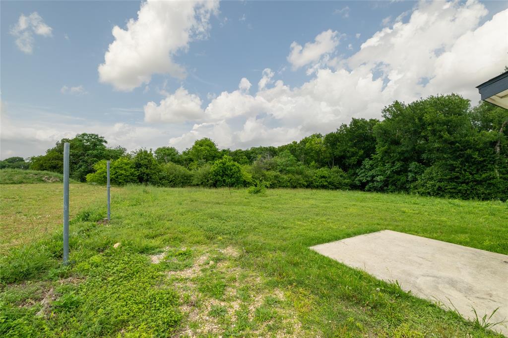 805 East Belt Line Road DeSoto, TX 75115 - Photo 13 of 15 a view of a field of grass and trees