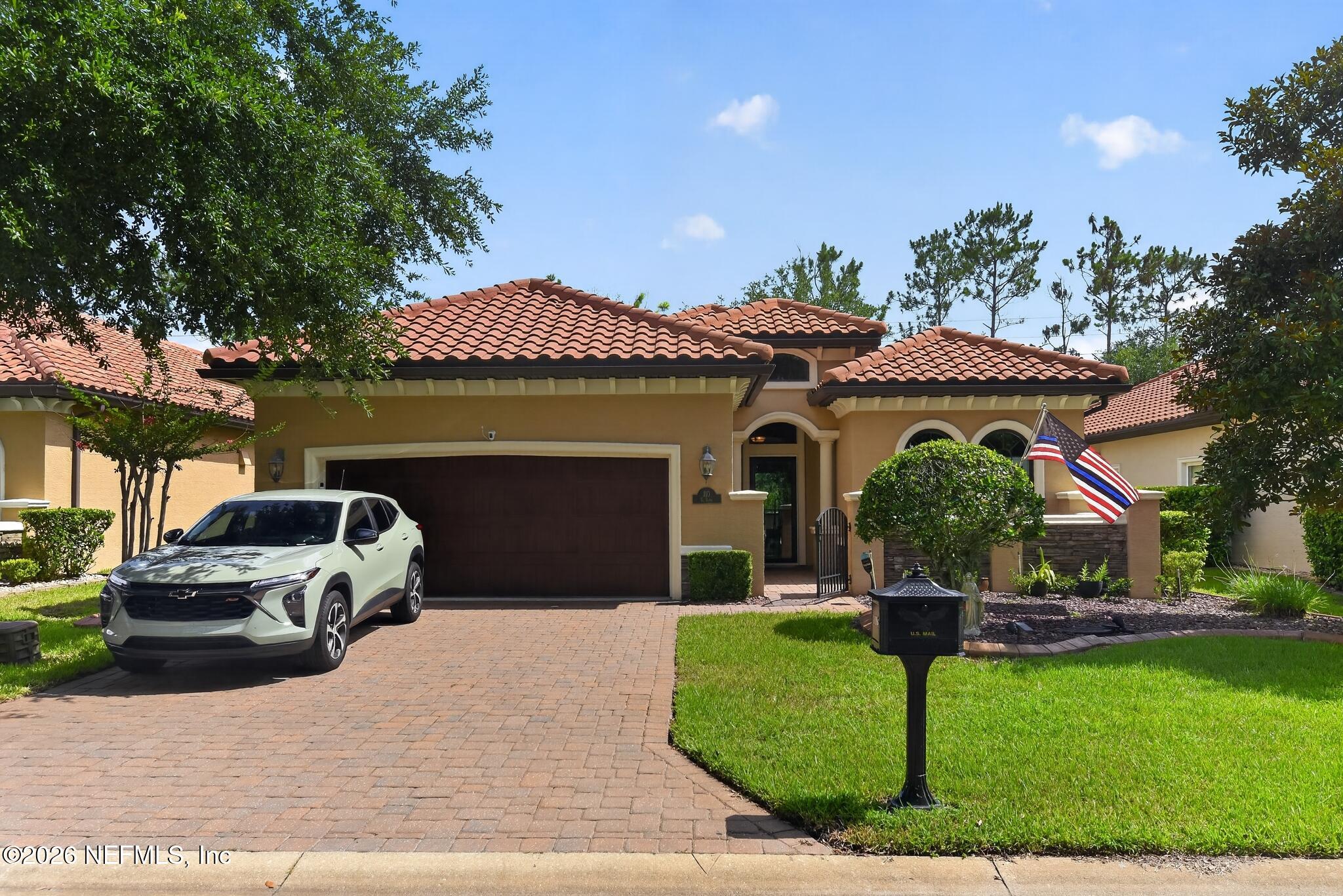 110 Vía Roma Ormond Beach, FL 32174 - Photo 3 of 43 a front view of a house with garden