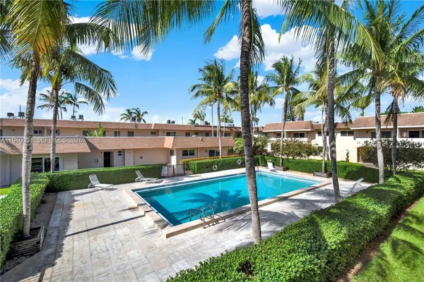 a view of a backyard with a palm tree