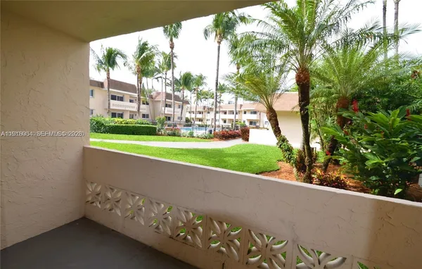 a view of a back yard from a balcony